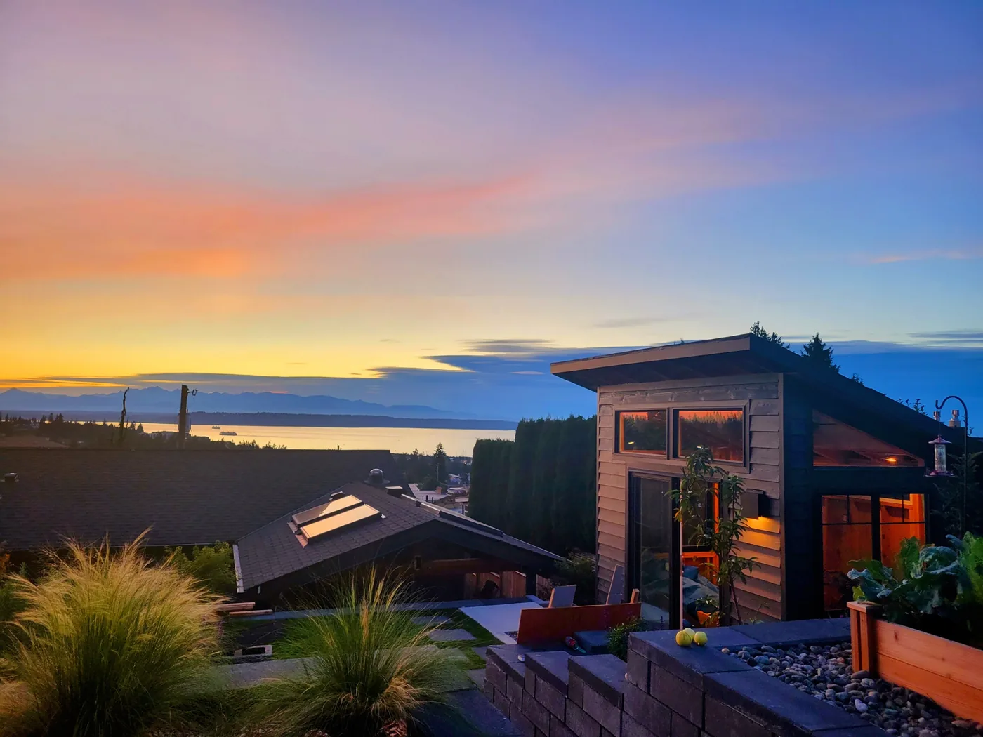 Integrated deck with panoramic water views at dusk